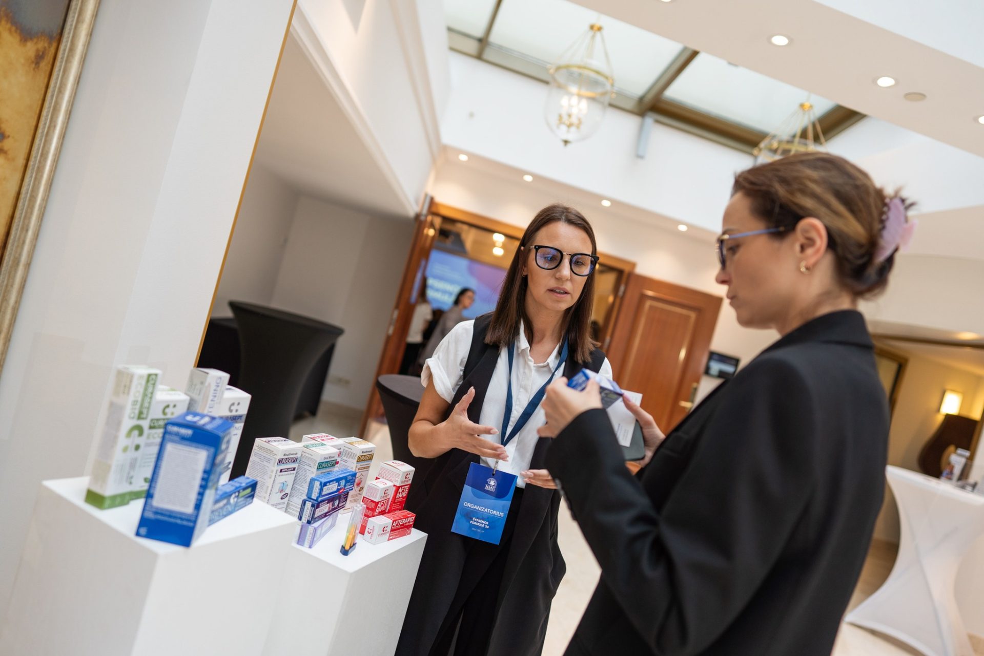 A Curasept image showing staff and products at a trade event.